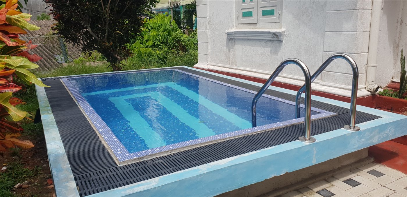 Swimming pool beside the villa wall